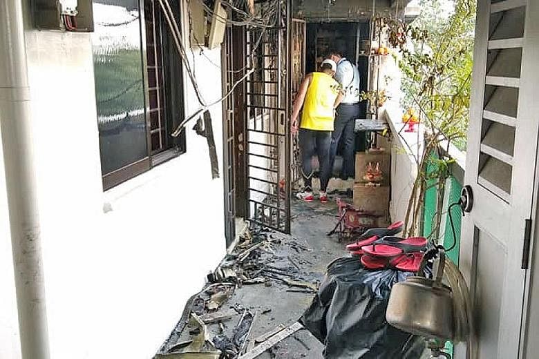 The aftermath of a fire that broke out at Block 235 Toa Payoh Lorong 8 yesterday. Neighbours rushed to the scene to help put out the fire. The Singapore Civil Defence Force finally extinguished the fire with a water jet.