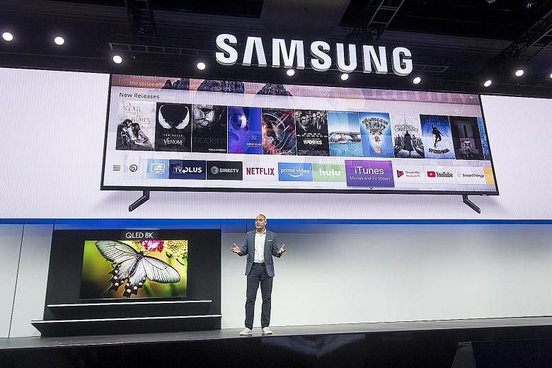 Mr Dave Das, senior vice-president of consumer electronics at Samsung Electronics America, giving a presentation of his company's new range of TV units, which will have a dedicated iTunes app. With the trend towards bigger TVs, Samsung and LG have un