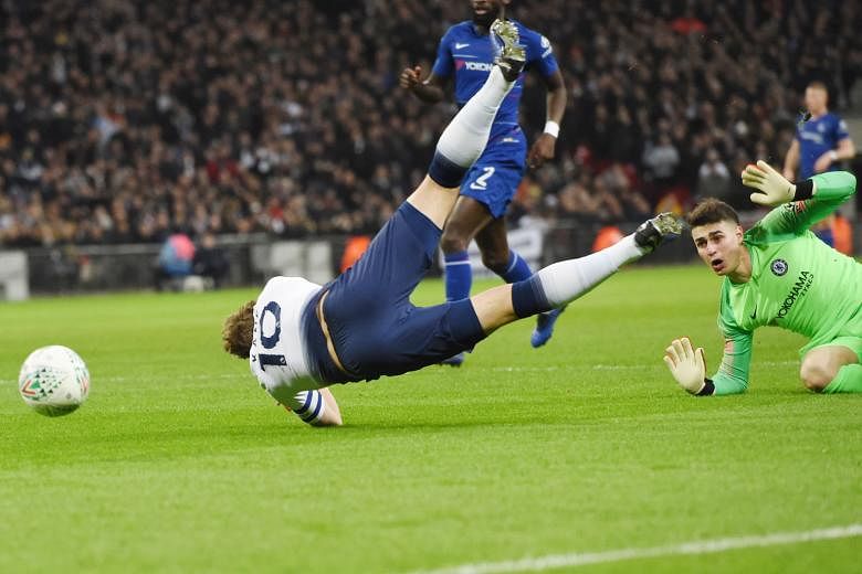Tottenham Hotspur striker Harry Kane tumbling to the ground in the penalty box after being fouled by Chelsea goalkeeper Kepa Arrizabalaga. He converted the resulting penalty after the video assistant referee had its say.