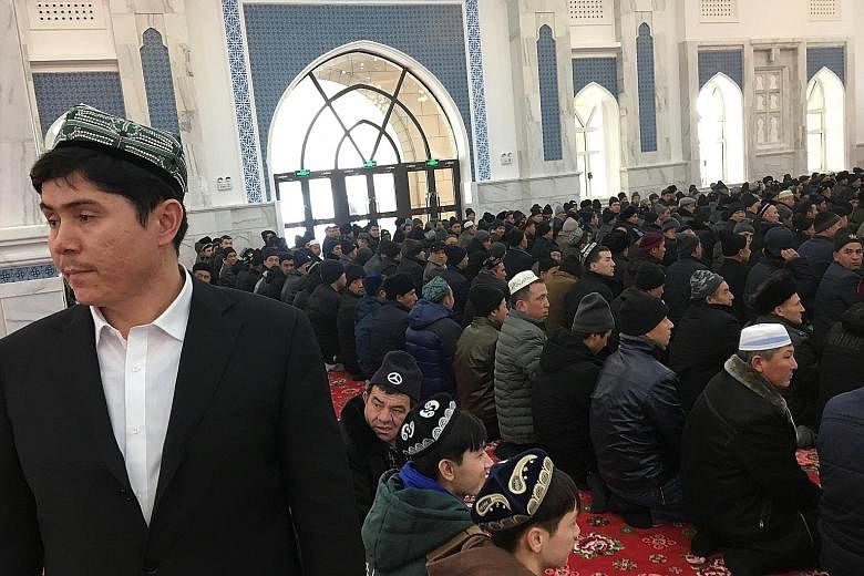 Worshippers in the mosque at the Xinjiang Islamic Institute during a Chinese government-organised trip last week in Urumqi, Xinjiang.