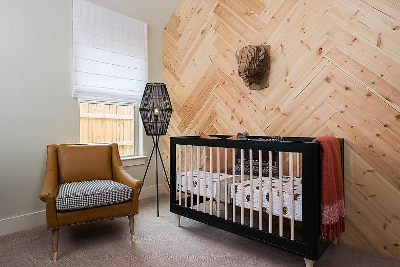 (Top) A wall of wood adds a rustic touch to this nursery. (Above) If installing wood in a bathroom, choose one more resistant to mould. A room with a high ceiling can seem cold. But wood can be used to warm it up.