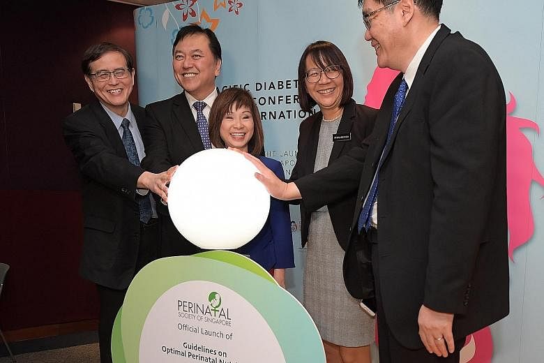 From left: Professor Tan Kok Hian; Professor Alex Sia, CEO of KK Women's and Children's Hospital (KKH); Senior Minister of State for Health Amy Khor; Dr Chua Mei Chien; and Associate Professor Ng Kee Chong, chairman of the medical board at KKH, at th