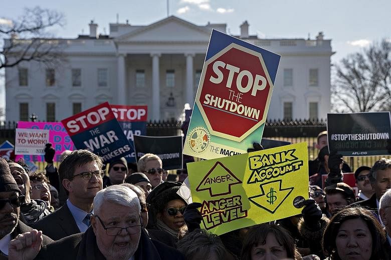 Demonstrators, union members and federal employees at a rally outside the White House on Thursday to call for an end to the partial government shutdown.