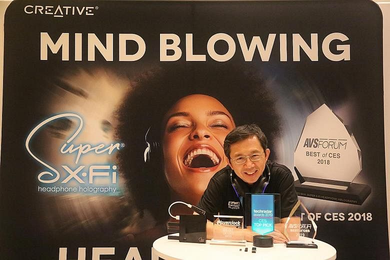 Creative chief Sim Wong Hoo with some of the awards the firm's Super X-Fi products won at CES 2019.