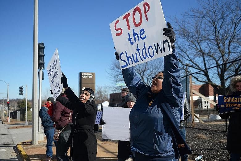 Department of Agriculture workers in St Louis protesting against the partial government shutdown on Wednesday.