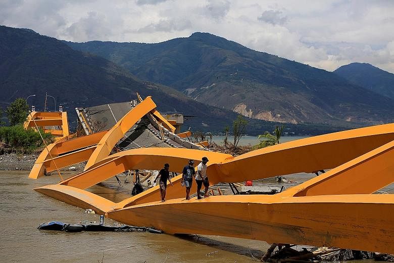 A road bridge in ruins after it was hit by an earthquake and tsunami in Palu, Sulawesi island, Indonesia, in October last year. At least 37,000 schools nationwide are located in disaster-vulnerable regions and the Indonesian authorities want to bette