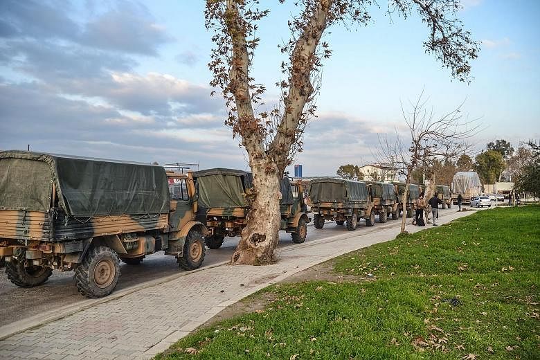 A Turkish military convoy in Kirikhan at the Syrian border last Saturday. Turkey has vowed to crush a US-backed Kurdish militia which it views as a terrorist group, but which has been a US ally in the fight against ISIS in Syria.