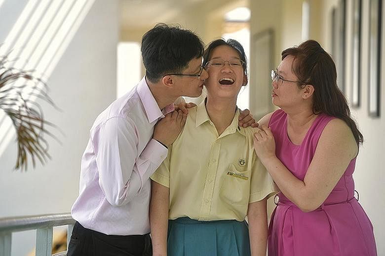 Benecia Tang with her dad Vincent, an engineer, and mum Emily, a teacher. The Crescent Girls' School girl has dyslexia and hopes to set up a social enterprise for children with learning difficulties one day.