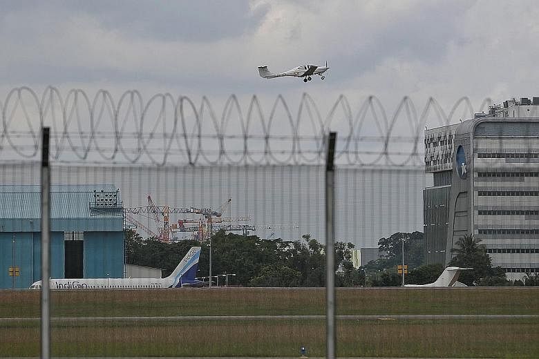 The new Instrument Landing System (ILS) uses the exact same flight path that aircraft landing at Seletar Airport (left) have used all along for visual flights. The only difference is with ILS, pilots can land even in bad weather, says Foreign Ministe