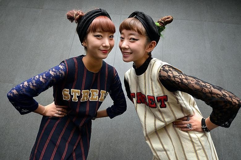 Tokyo-based models and DJs Ami Amiaya (far left) and her sister, Aya Amiaya (left), follow director Tim Burton on social media. And Ksenia Chilingarova (above) follows the Instagram account of artist Adam Hale.