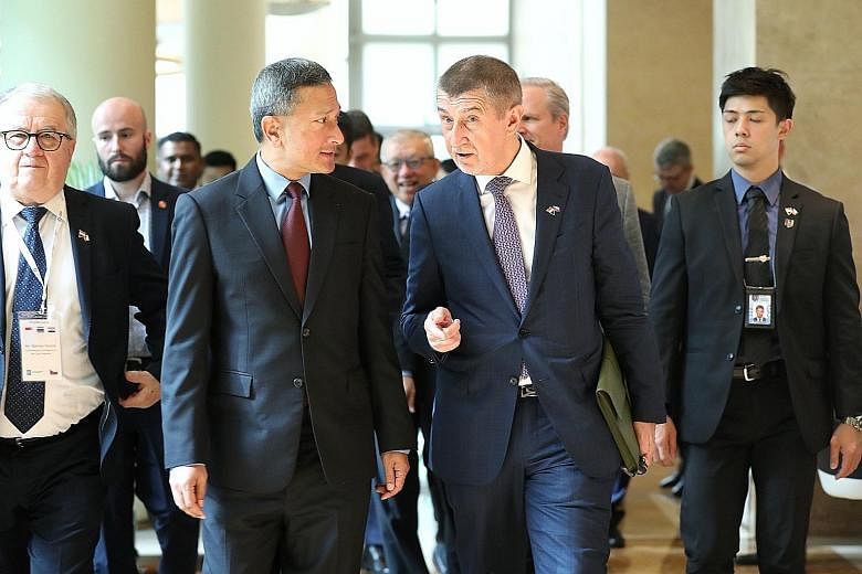 Left: Foreign Affairs Minister Vivian Balakrishnan and Czech Republic Prime Minister Andrej Babis arriving at The Ritz-Carlton, Millenia Singapore, for the fourth Singapore-Czech Republic Business Forum yesterday. Below: Mr Babis, flanked by Mr Chee 