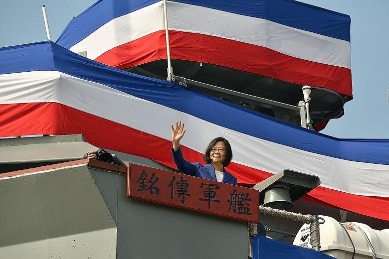 Taiwan's President Tsai Ing-wen waving from the deck of the Ming Chuan frigate during a ceremony to commission two guided missile frigates from the US for the Taiwan navy last November.