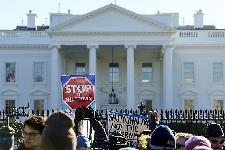 Federal workers, contractors and supporters rallying outside the White House last week to demand that President Donald Trump and the Senate end the partial shutdown.
