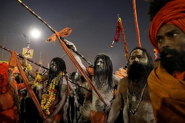Hindu holy men arriving to take a dip during the first grand bath of the Kumbh Mela in Prayagraj, India, on Tuesday.