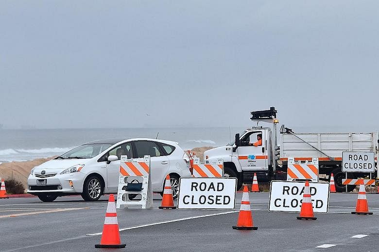 Vehicles being diverted on the Pacific Coast Highway as southern California faced another storm early on Wednesday, with rainfall expected to get heavier later into the day.