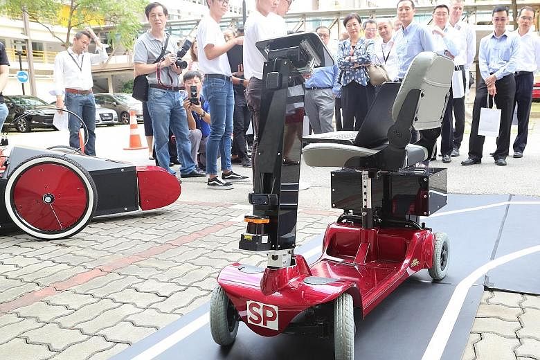 Engineering students from Singapore Polytechnic demonstrating how their project, SP Driverless And Electrifying Car, works at Singapore Polytechnic Engineering Show 2019 and 5G Garage opening event yesterday.