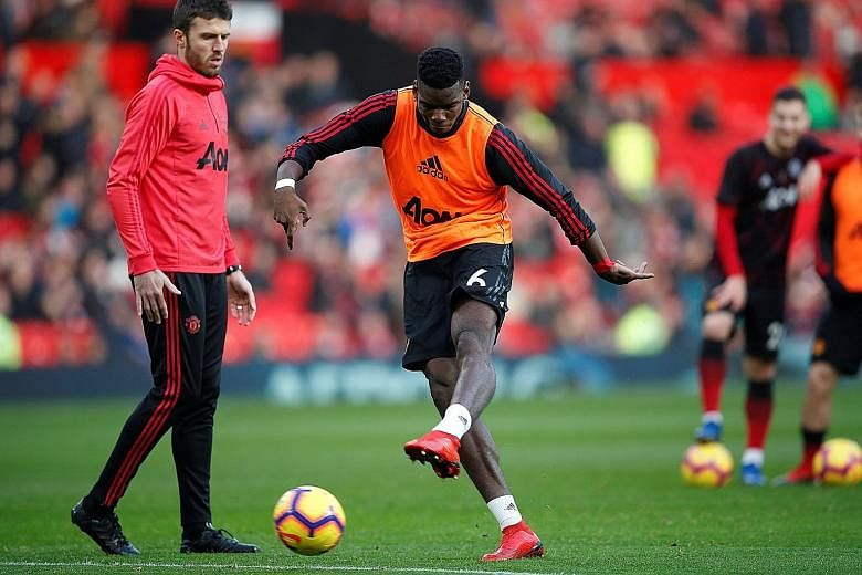 Manchester United midfielder Paul Pogba has been impressive under the guidance of caretaker manager Ole Gunnar Solskjaer and his assistant Michael Carrick (left), scoring four league goals and recording four assists in his last five matches.