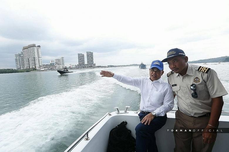 Johor Menteri Besar Osman Sapian (in white) visited a Malaysian government vessel anchored in Singapore's territorial waters on Jan 9. An annual bilateral meeting between Singapore and Malaysia, set for the following Monday, was postponed following D