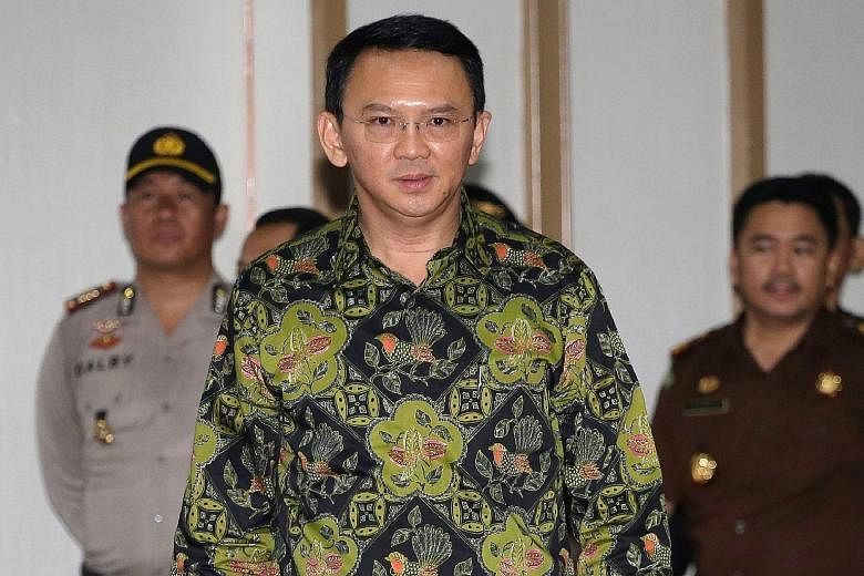 Basuki Tjahaja Purnama, also known as Ahok, seen here arriving in court in April 2017. He was sentenced to jail for blasphemy. In the letter posted on social media, he said his time in prison had allowed him "to learn to take full control of myself f