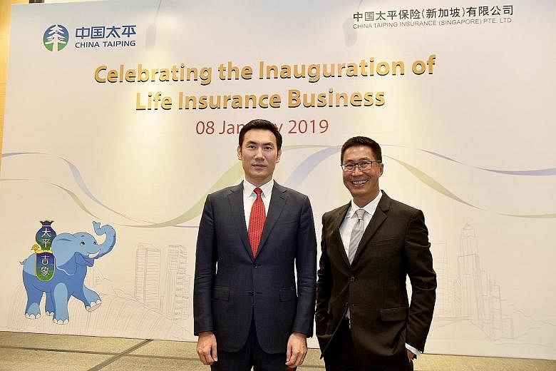 Mr Yang Yamei (left), general manager of China Taiping Insurance Singapore, and Mr Lance Tay, general manager for life insurance, at the inauguration of the company's life insurance business.