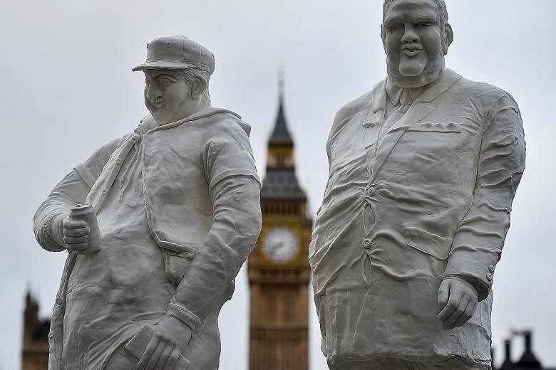 Sugar sculptures in front of the Houses of Parliament in London. Britain's sugar tax has raised £154 million (S$269 million) in its first seven months and is expected to raise about £240 million annually.