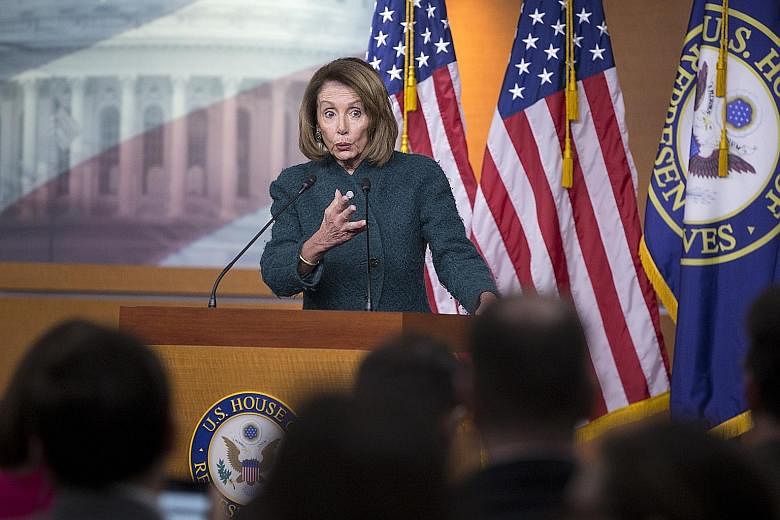Democratic House Speaker Nancy Pelosi holding a news conference in Washington this month. The US' partial government shutdown has extended into a fifth week and remains at an impasse. Mrs Pelosi plans to have the House vote on its own border security