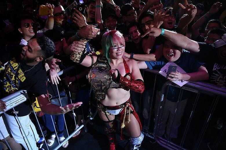 TEG chief executive Geoff Jones (above) aims to offer more live entertainment options in Singapore. In 2017, his company staged wrestling event WWE Live Singapore, which NXT Women's Champion Asuka (left) took part in.