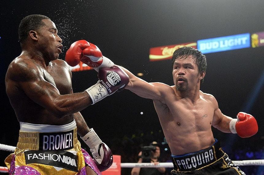 Manny Pacquiao landing a punch on Adrien Broner during their WBA welterweight world title bout at MGM Grand on Saturday. Pacquiao won on all three judges' scorecards, including by one tally of 117-111. The other two judges also had it one-sided at 11