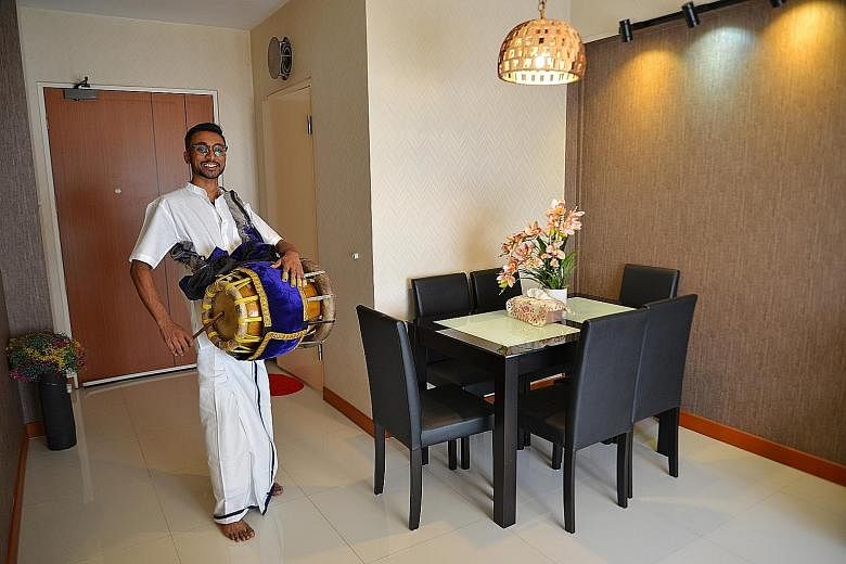 Mr Jathishweran Naidu dressed in traditional Indian garments and carrying his thavil. The 24-year-old will play the instrument for eight to 10 hours during the Thaipusam procession from 3am today with his group, Hanusakthi Hanuman Dass.