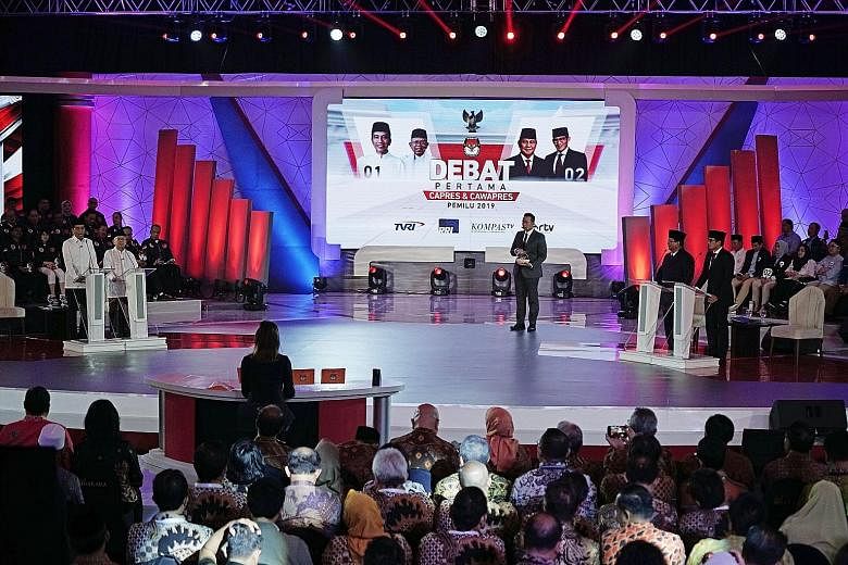 President Joko Widodo speaking during the first presidential debate last Thursday in Jakarta, which was aired live. He and his challenger, Mr Prabowo Subianto, as well as their respective running mates, Dr Ma'ruf Amin and Mr Sandiaga Uno, were provid