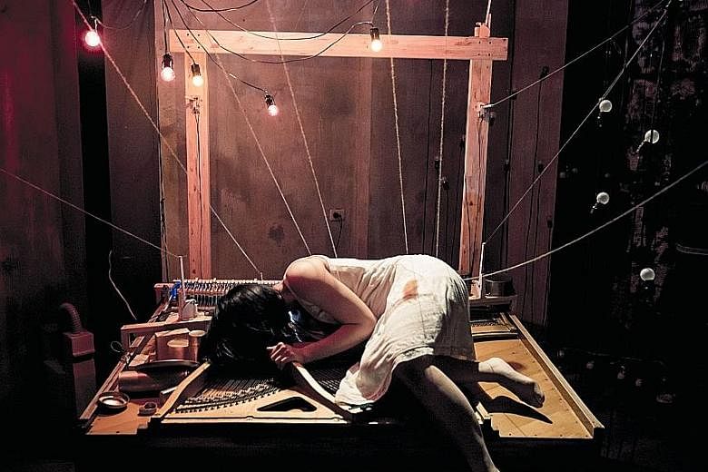 In Taiwanese group M.O.V.E. Theatre's Dear John performance (above), a dancer is bound to a deconstructed piano.