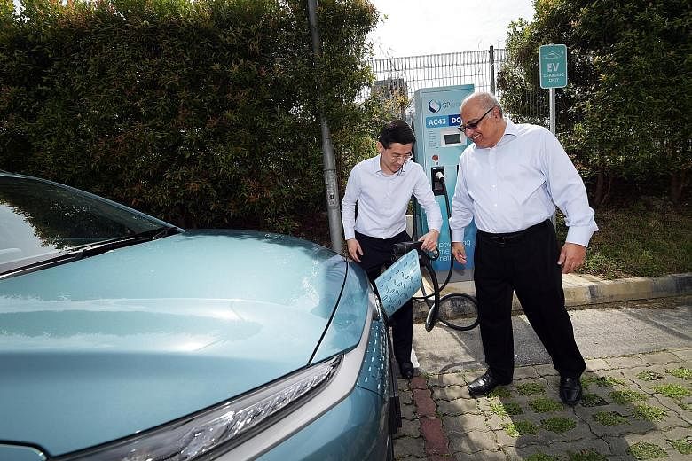 Mr Wong Kim Yin, SP Group chief executive officer, and Mr Manohar Khiatani, deputy group CEO of Ascendas-Singbridge Group, launching a high-speed electric vehicle charging station yesterday that will enable users to charge their electric vehicles at 