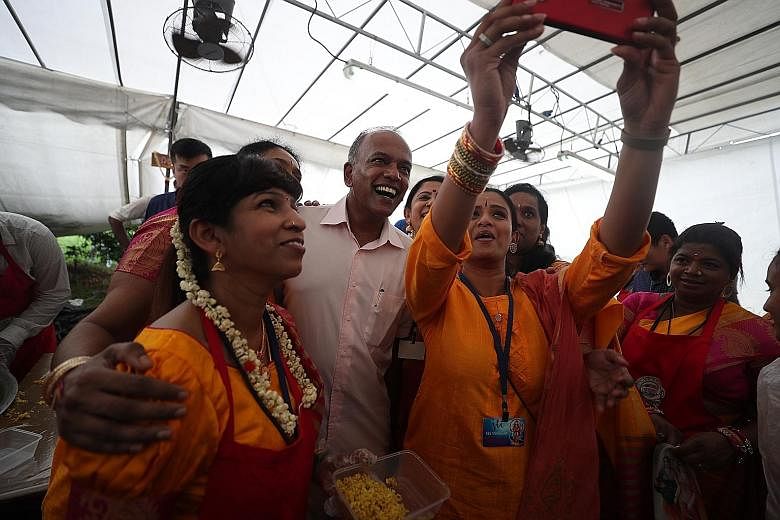 Volunteers taking a wefie with Home Affairs and Law Minister K. Shanmugam. Over the years, steps have been taken to allow music at Thaipusam, he noted. Devotees carrying milk-pot offerings as they walked to Sri Thendayuthapani Temple. This was the fi