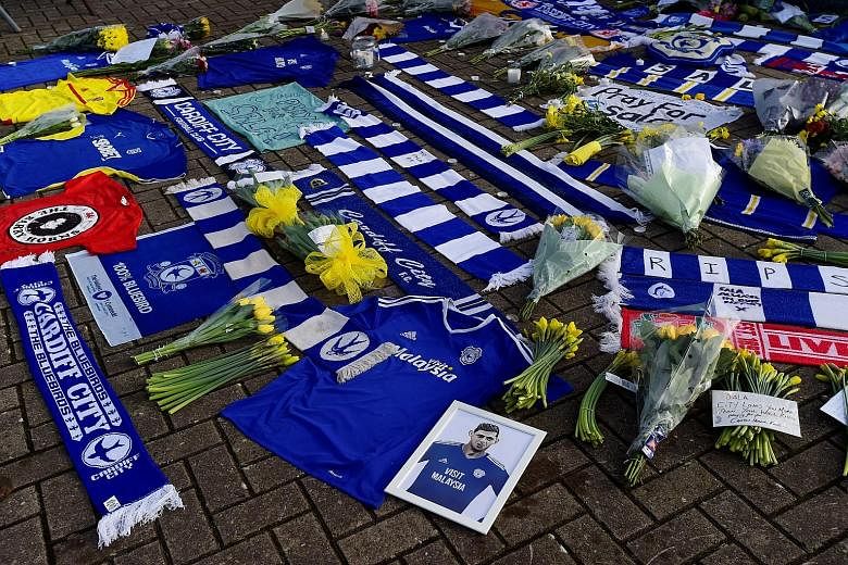 Emiliano Sala has yet to play in Cardiff City's colours, but Bluebirds fans have been leaving tributes, including jerseys and yellow daffodils outside the stadium for their record signing.