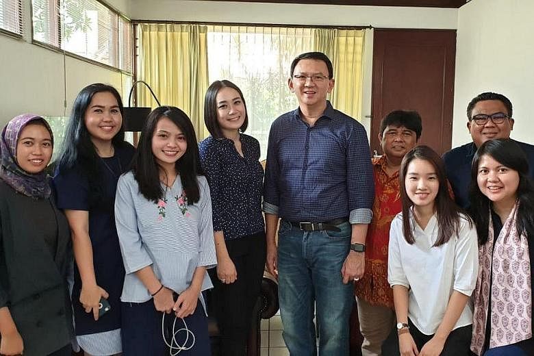 Former Jakarta governor Basuki Tjahaja Purnama is seen here in a photo by Antara Foto with his relatives after his release from prison yesterday. Media reports say marriage forms for his wedding have been submitted.