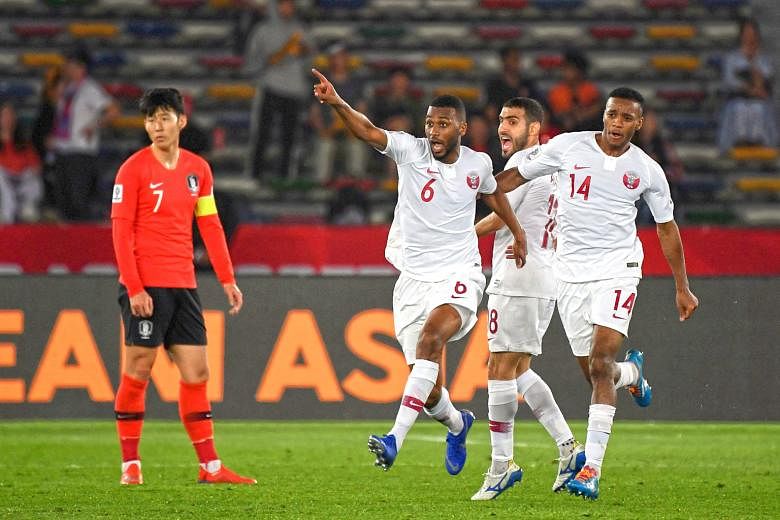 Qatar's Abdulaziz Hatem (No. 6) celebrating his goal against South Korea during their 1-0 Asian Cup quarter-final win yesterday, as Korean captain Son Heung-min can only look on. The goal was enough to see the Qataris progress to the last four at the