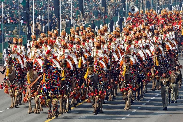 Indian Border Security Force (BSF) soldiers riding their camels during yesterday's Republic Day parade in New Delhi. Large crowds thronged the parade, which featured a cultural extravaganza of dances and gymnastics, colourful floats from Indian state