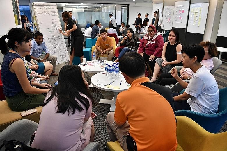 Second Minister for Education Indranee Rajah (at right) making a point at a session held by Uplift at the Ministry of Education in Buona Vista. The discussion included community strategies to tackle long-term absenteeism.