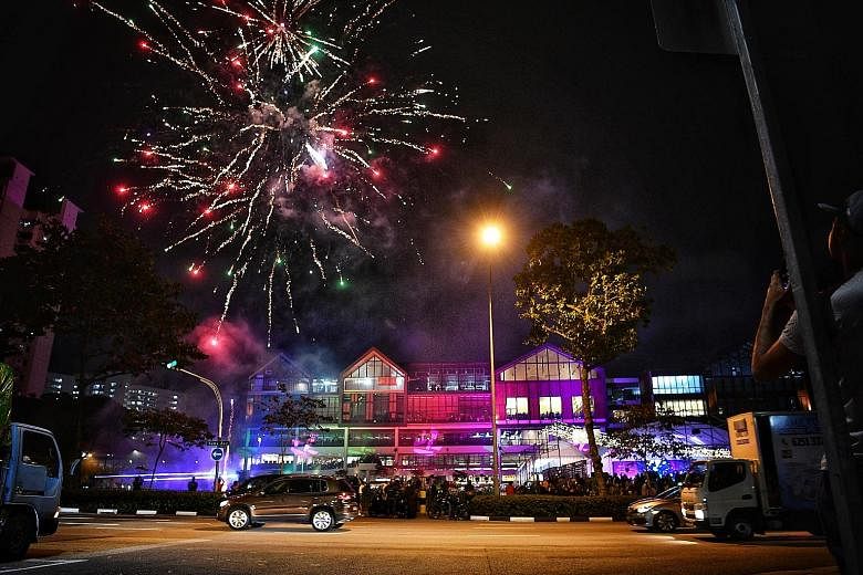 Above: A three-day festival was held in conjunction with the opening, which included fireworks. Left: Wisma Geylang Serai will be the centre stage for a variety of services, programmes and community-based activities.
