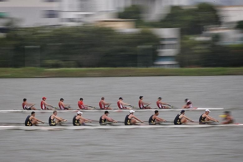 Royal Hong Kong Yacht Club (in black) pipping Singapore's Easter Rowing Club to first place in the Open men's eight at Pandan Reservoir yesterday. The race was part of the 3-Way Regatta, the first inter-club event launched by Easter and in collaborat