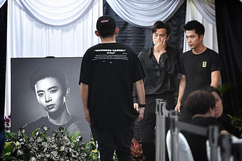 Also spotted among the mourners were celebrities Christopher Lee (centre) and Fann Wong (beside him). From right: Actors Xu Bin and Ian Fang, close friends of Mr Pang, at the wake. Actress and model Sheila Sim (left) and actor Chen Hanwei arriving at