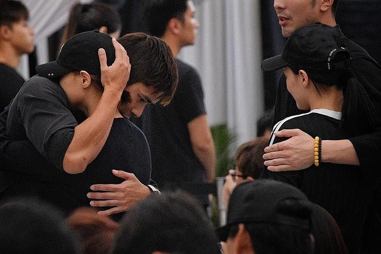 Also spotted among the mourners were celebrities Christopher Lee (centre) and Fann Wong (beside him). From right: Actors Xu Bin and Ian Fang, close friends of Mr Pang, at the wake. Actress and model Sheila Sim (left) and actor Chen Hanwei arriving at