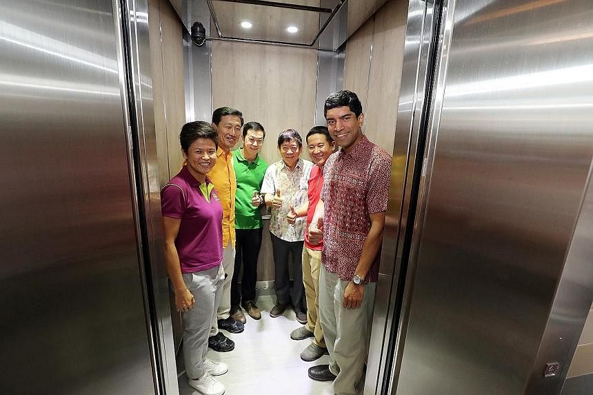 Sembawang GRC MPs (from second from left) Ong Ye Kung, Lim Wee Kiak, Khaw Boon Wan, Amrin Amin and Vikram Nair in a new lift at Block 772 Woodlands Drive 60 yesterday. With them is Ms Poh Li San, assistant secretary of Sembawang Citizens' Consultativ