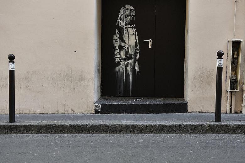 The stolen artwork by street artist Banksy on an emergency door at the Bataclan theatre in Paris, where a terrorist attack killed 90 people on Nov 13, 2015.