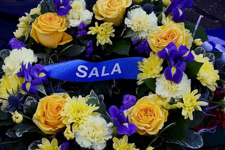 Tributes left outside Cardiff City Stadium for Emiliano Sala, whose plane disappeared from the radar over the English Channel last week.