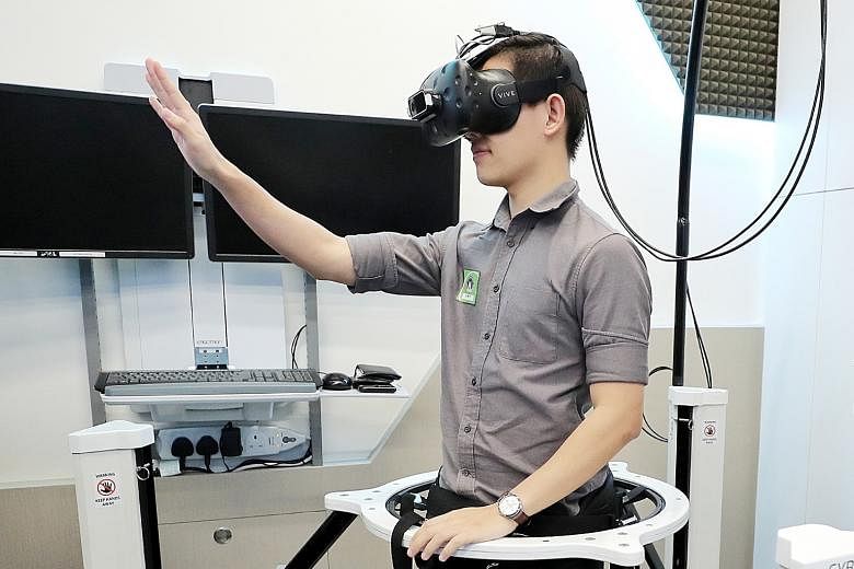 Above: The virtual reality (VR) platform allows trainees to hone their decision-making skills in a realistic but safe learning environment. Left: ST reporter Fabian Koh trying out the VR set-up, which allows the user to interact with a virtual crime 