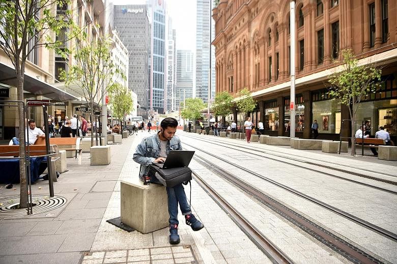 The central business district of Sydney. Australia's business conditions index - measuring hiring, sales and profits - slipped to two last month from 11 a month earlier, a National Australia Bank report showed yesterday. The result dovetails with slo