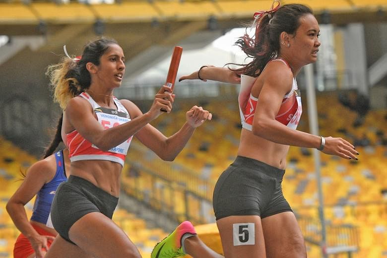 Shanti Pereira passing the baton to anchor runner Nur Izlyn Zaini in the 2017 SEA Games 4x100m final, where they set a Singapore record of 44.96 seconds with Wendy Enn and Dipna Lim Prasad.