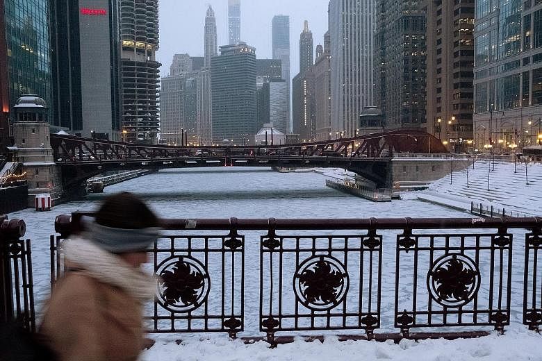 The Chicago River in Chicago, Illinois, was filled with chunks of ice. A low of -23 deg C was forecast in the city yesterday.
