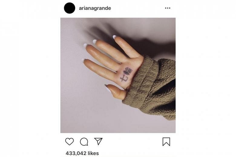 Ariana Grande attempts to fix botched Japanese tattoo  Loop PNG